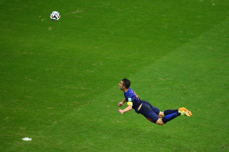 Illustration for article titled The Best Photos Of Robin Van Persie's Amazing Flying Header Goal